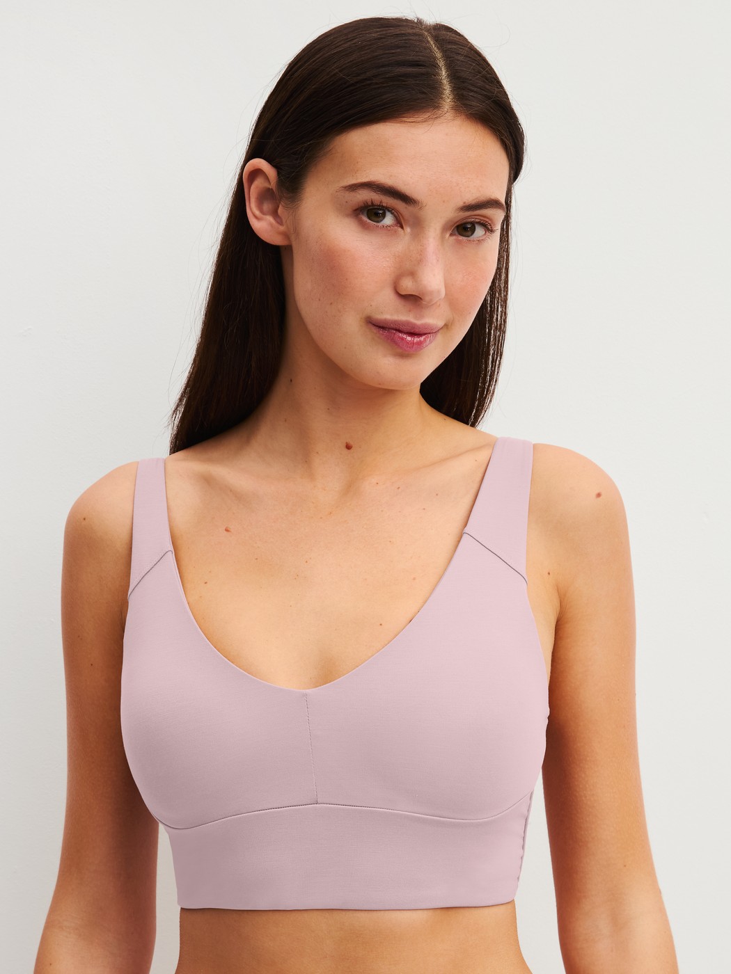 Women model is wearing Bustier with adjustable straps made of Modal in Purple, Unicoloured from the Natural Skin series by CALIDA, Front view
