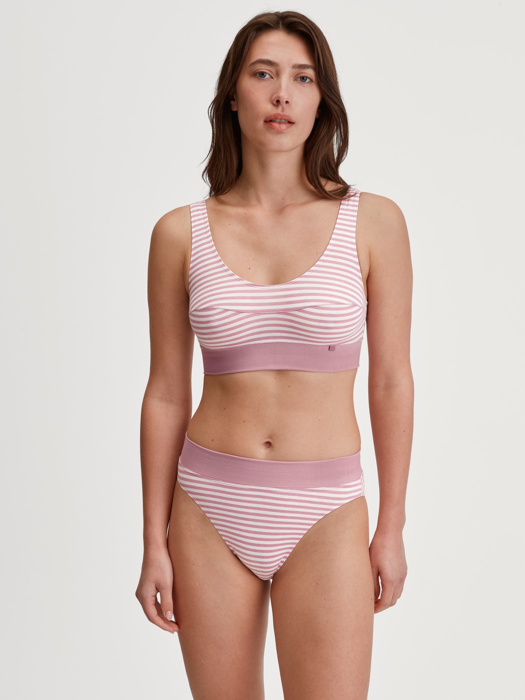 Women model is wearing Bustier made of Cotton in Pink, Striped from the Elastic series by CALIDA, Outfit