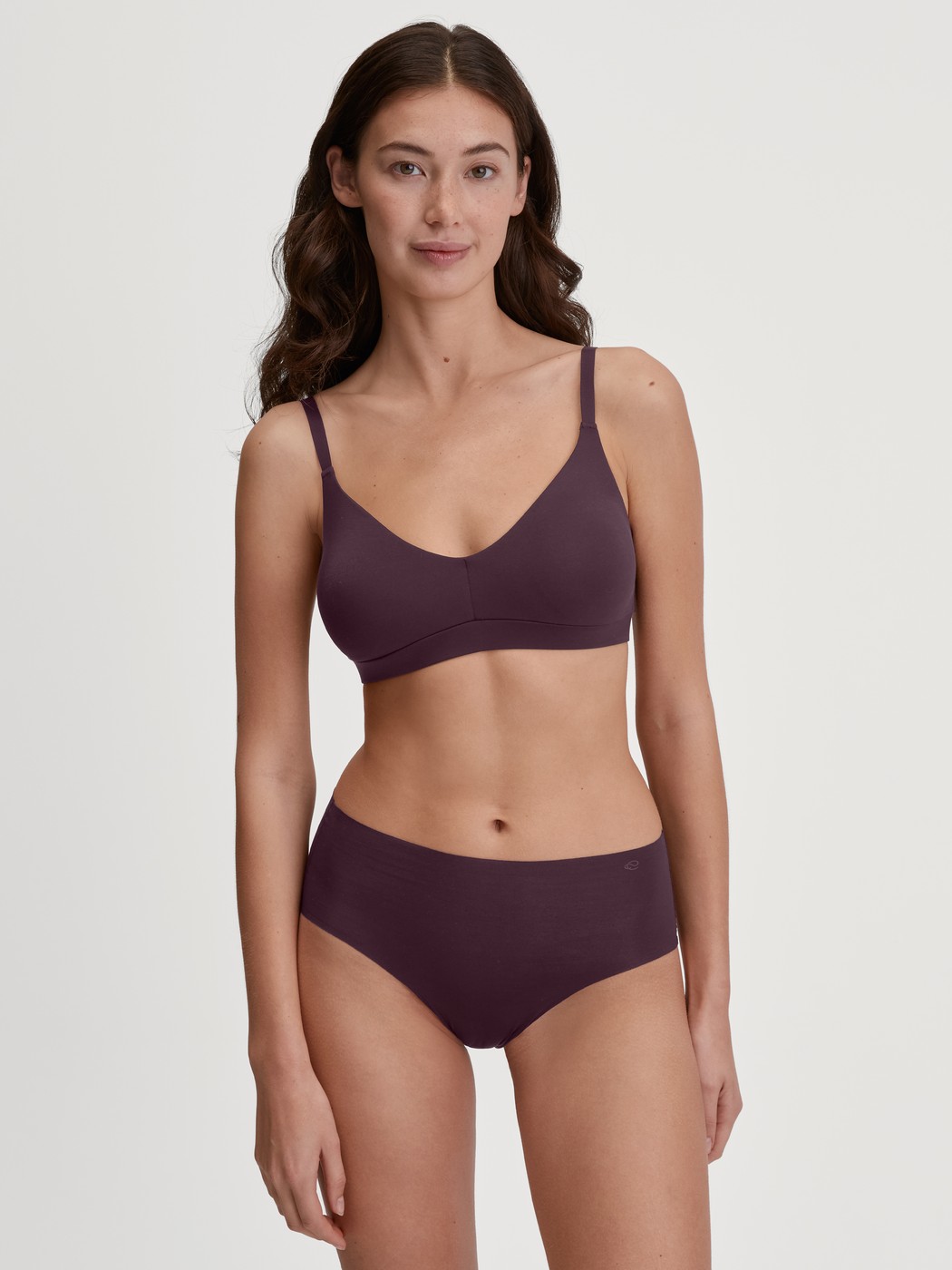 Women model is wearing Bustier with adjustable straps & removable pads made of Modal in Red, Unicoloured from the Natural Skin series by CALIDA, Outfit