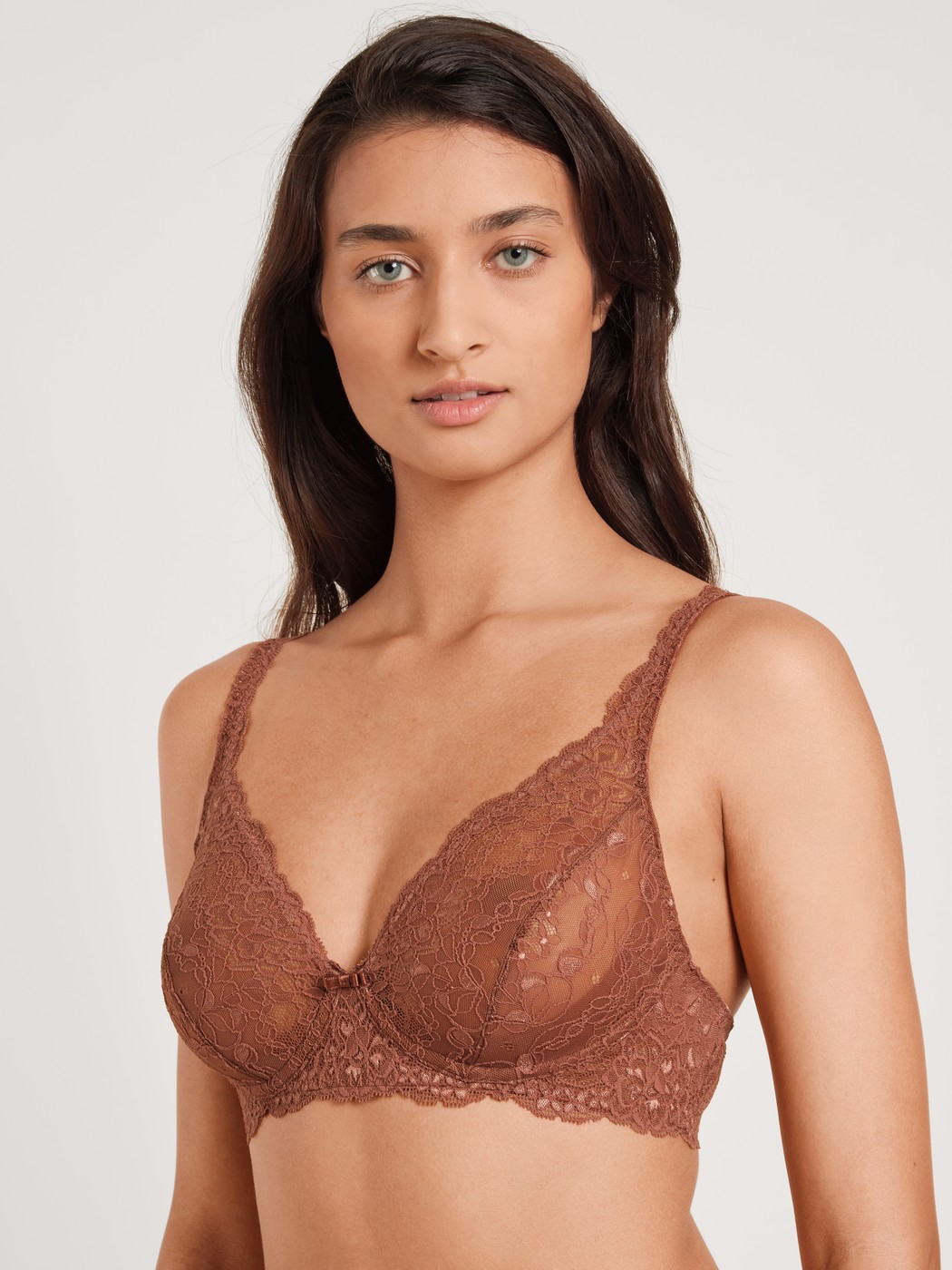 Women model is wearing Soft non-wired bra made of Polyamide in Brown, Lace from the Sensual Secrets series by CALIDA, Front view