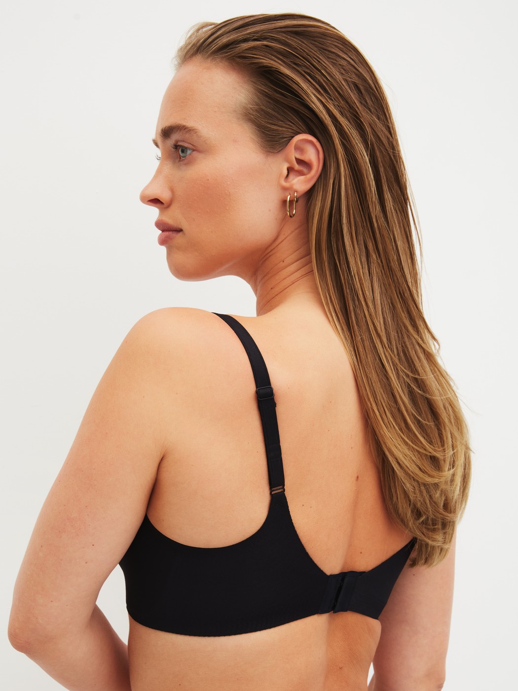 Women model is wearing Bonded Bra made of Modal in Black, Unicoloured from the Natural Skin series by CALIDA, Back view
