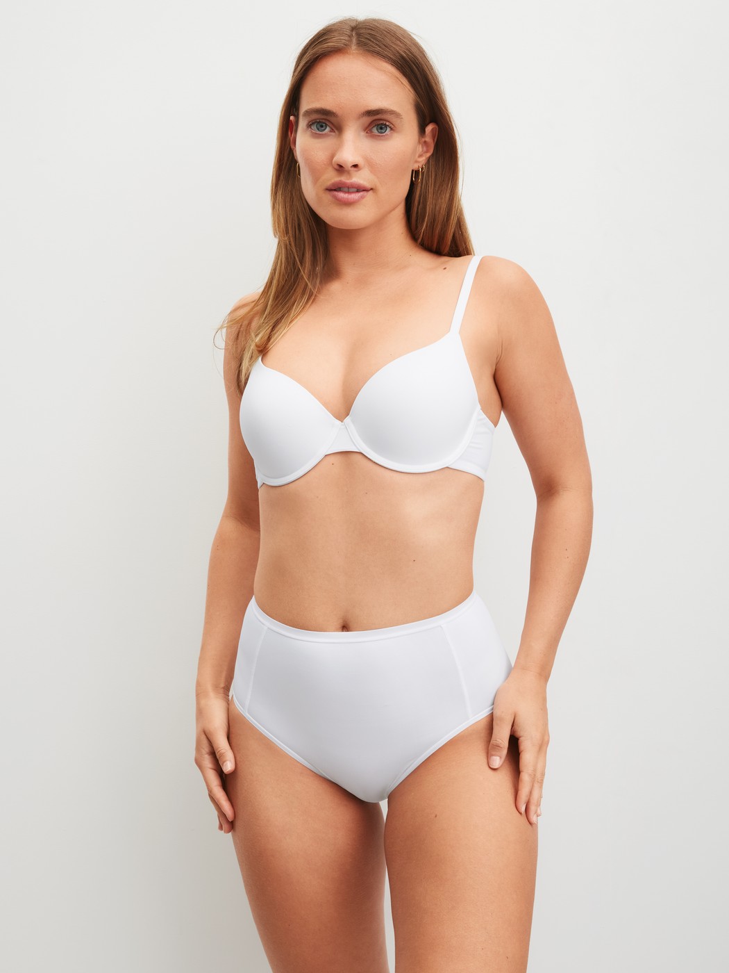 Women model is wearing Moulded Bra with Multiway Straps made of Polyamide in White, Unicoloured from the Sleek Skin series by CALIDA, Outfit