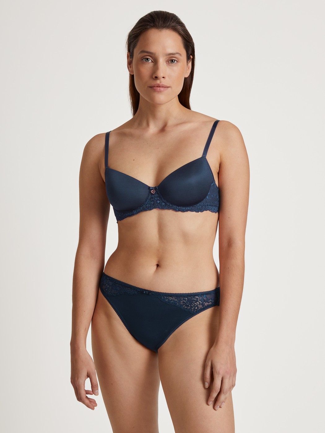 Women model is wearing Underwired T-shirt bra with padding made of Viscose in Blue, Lace from the Sensual Secrets series by CALIDA