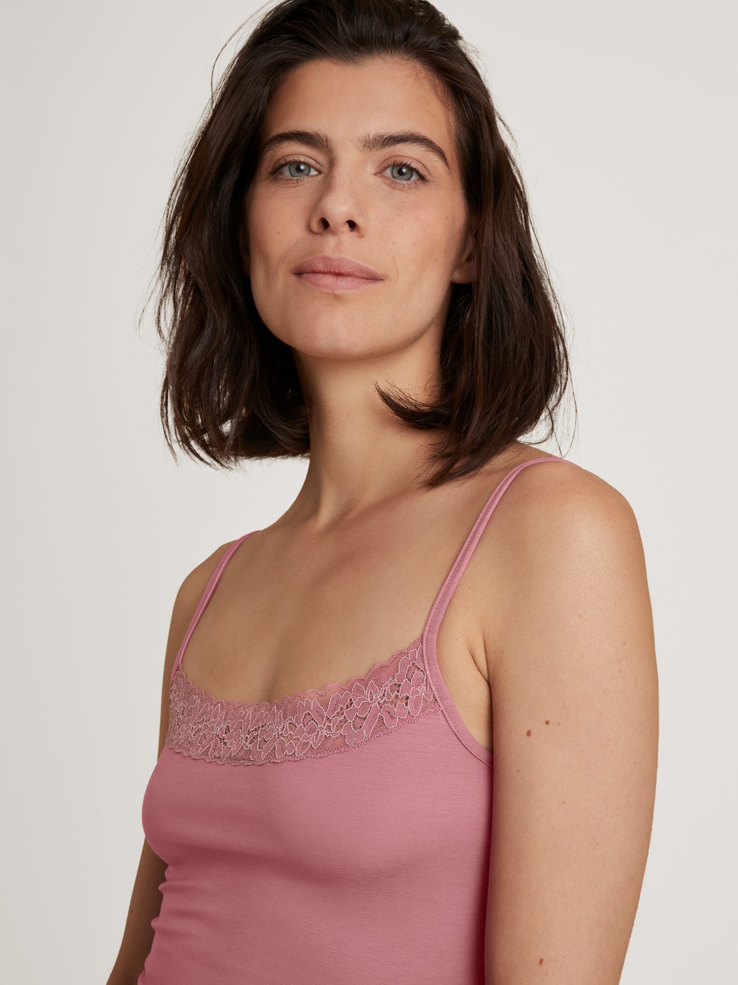 Women model is wearing Spaghetti top made of Cotton in Pink, Lace from the Nat. Comfort Xtra series by CALIDA, Detail