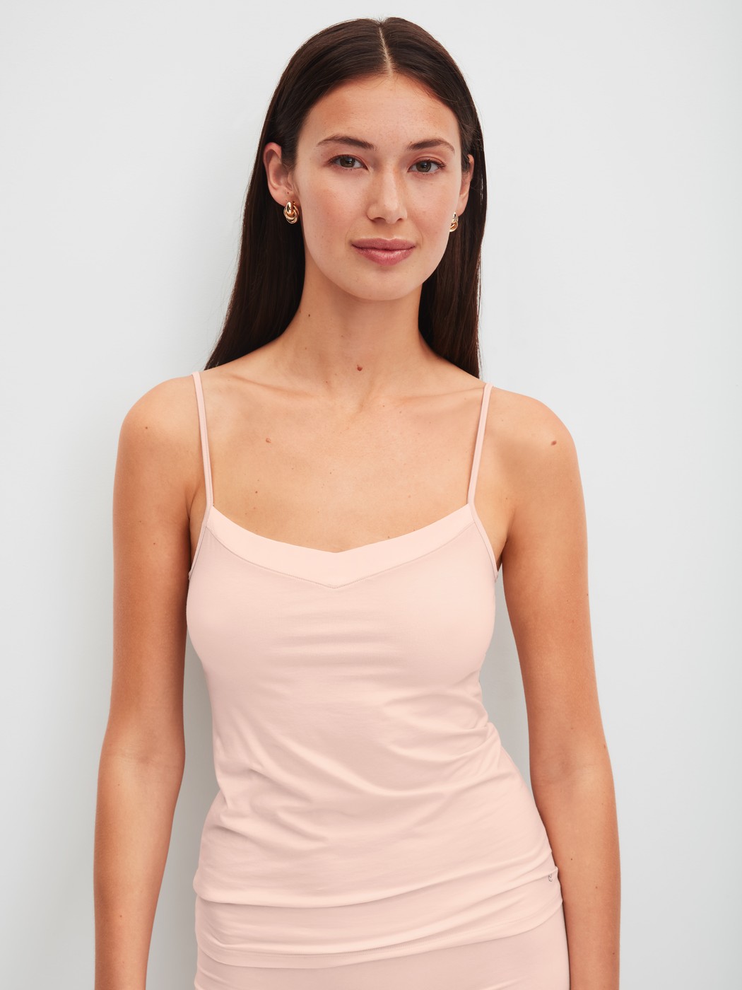 Women model is wearing Spaghetti top made of Cotton in Pink, Unicoloured from the Cate series by CALIDA, Front view
