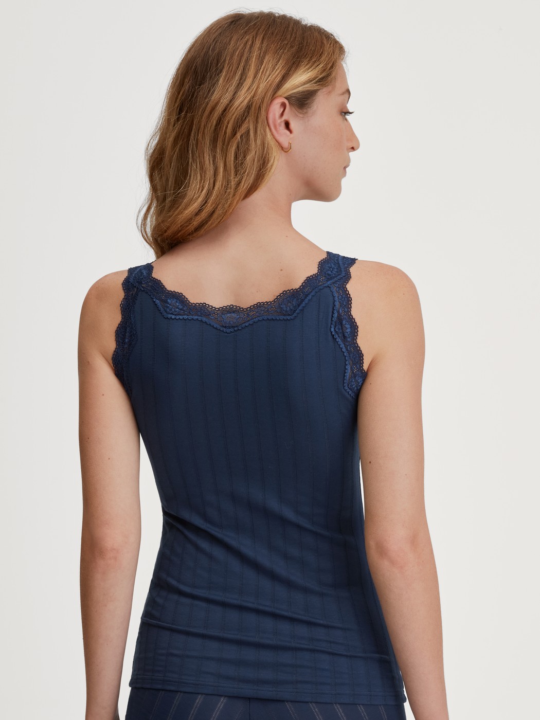 Women model is wearing Tank top made of Cotton in Blue, Lace from the Etude Toujours series by CALIDA, Back view