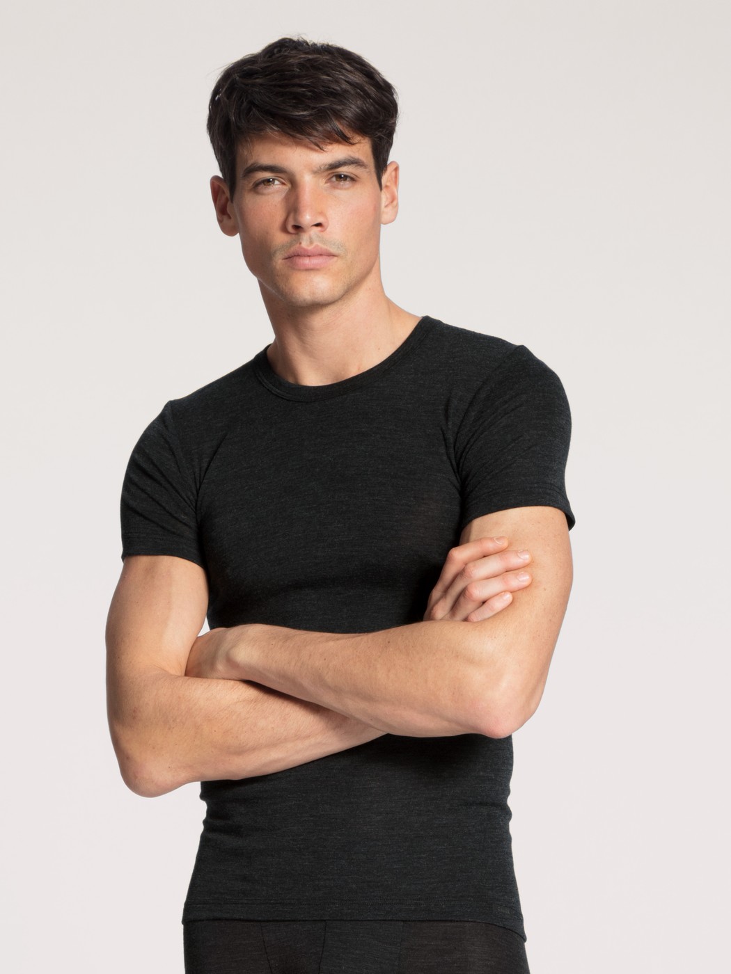 Men model is wearing T-shirt made of Wool in Blue, Unicoloured from the Wool & Silk series by CALIDA, Front view