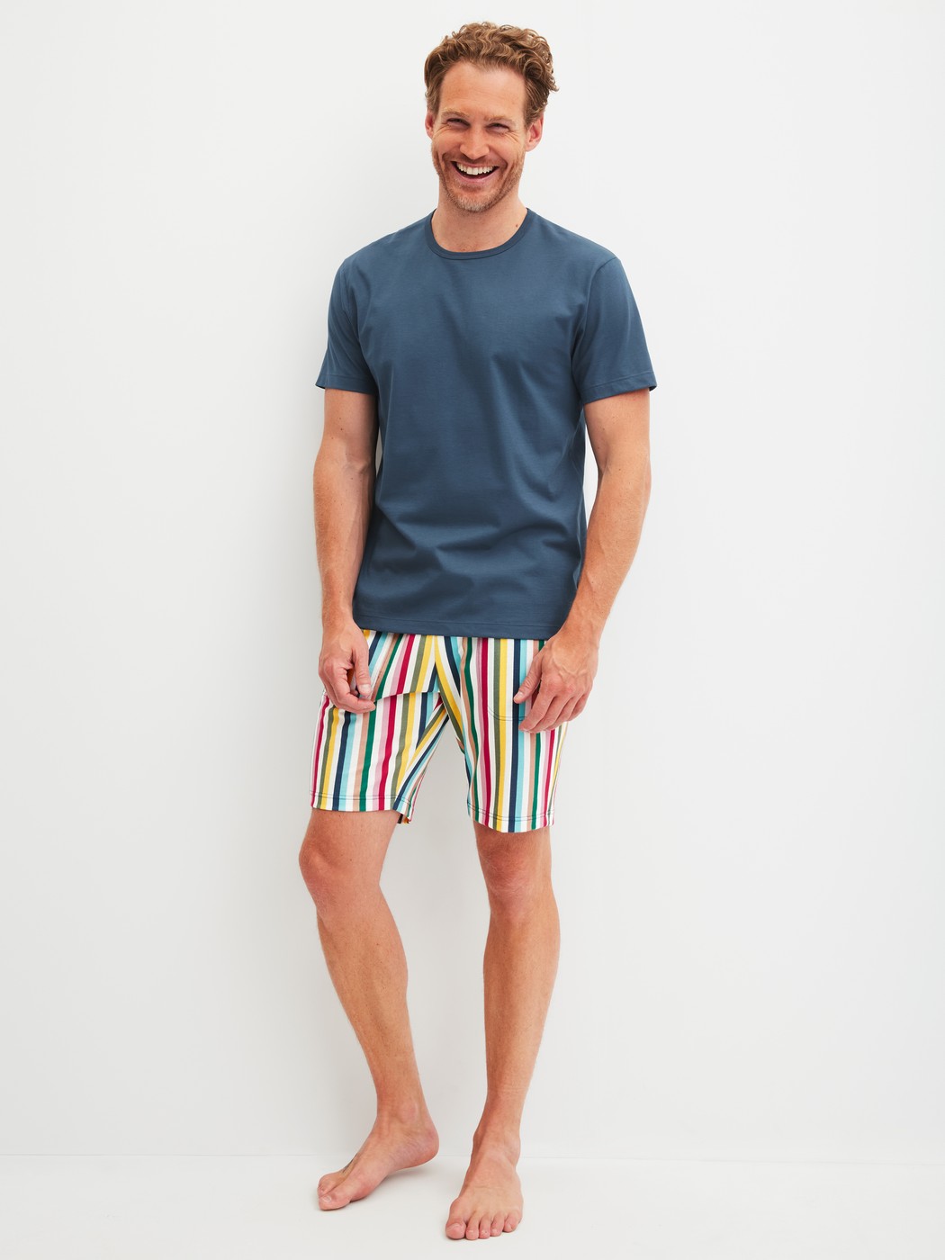 Men model is wearing Short-sleeved shirt made of 100% Cotton in Blue, Unicoloured from the RMX Sleep Holiday series by CALIDA, Outfit