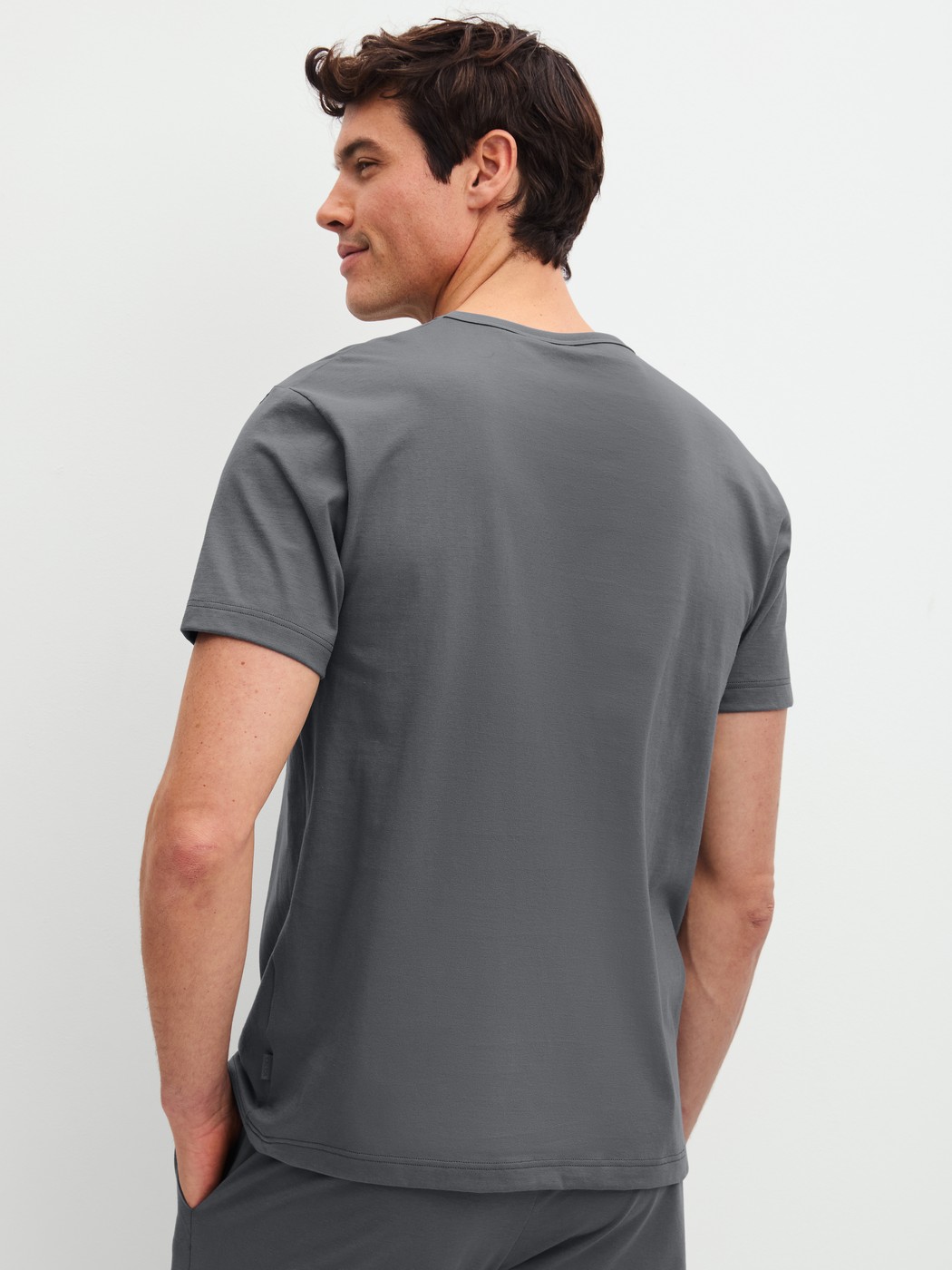 Men model is wearing Short-sleeved shirt made of 100% Cotton in Grey, Unicoloured from the RMX Sleep Leisure series by CALIDA, Back view