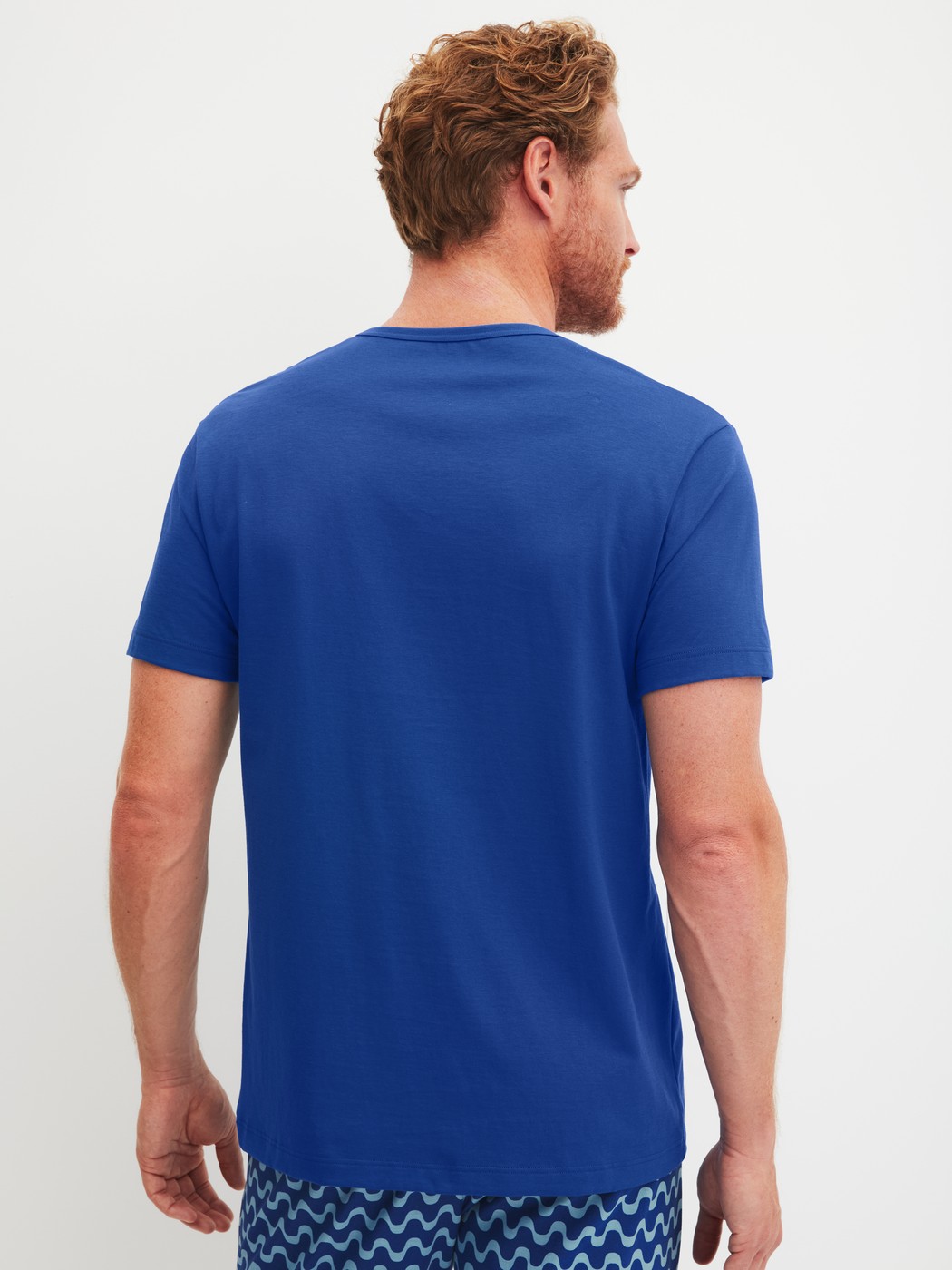Men model is wearing Short-sleeved shirt made of 100% Cotton in Blue, Unicoloured from the RMX Sleep Time off series by CALIDA, Back view
