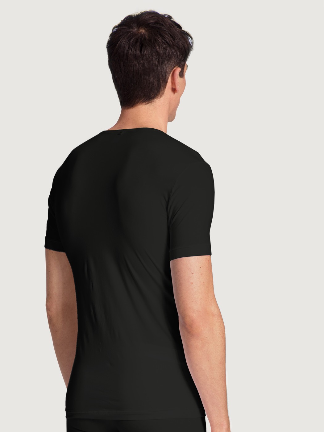 Le mannequin Homme porte le/la T-Shirt en Lyocell de couleur Noir, Unicolore, de la série Focus de CALIDA, Vue arrière