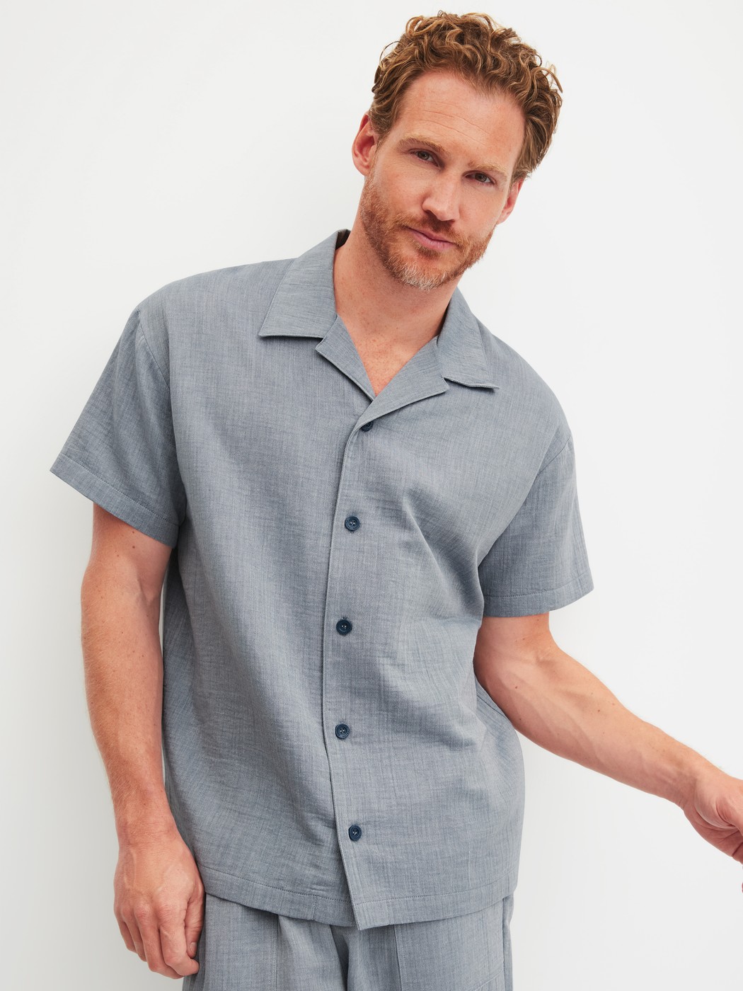 Men model is wearing Short shirt with button facing made of 100% Cotton in Grey, Unicoloured from the RMX Sleep Journey series by CALIDA, Front view