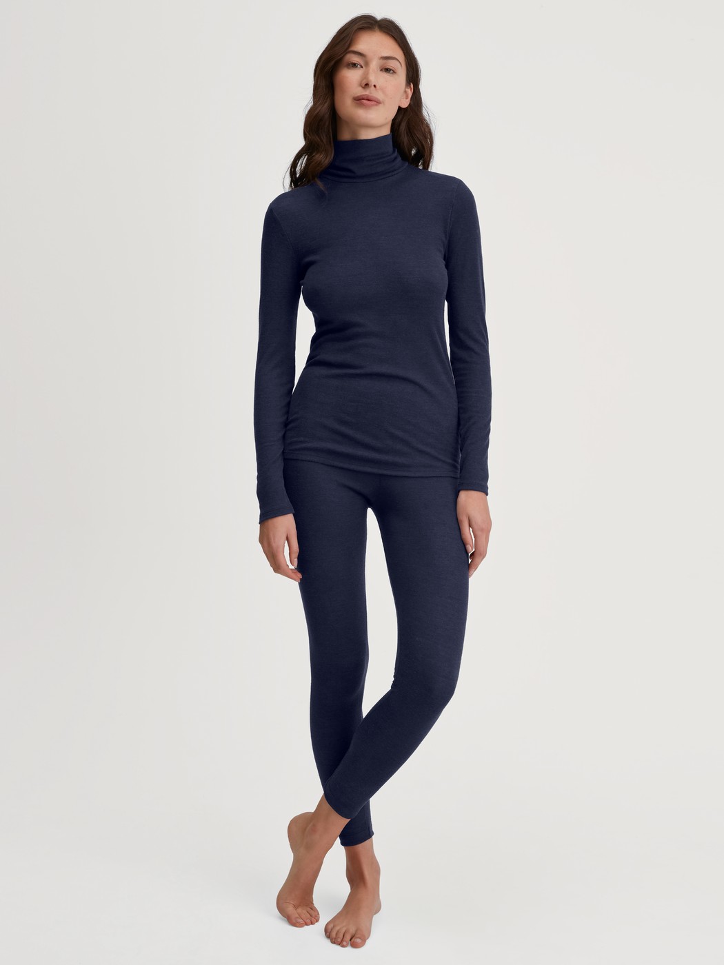 Women model is wearing Long-sleeve turtleneck shirt in wool-silk made of Wool in Blue, Unicoloured from the True Confidence series by CALIDA, Outfit