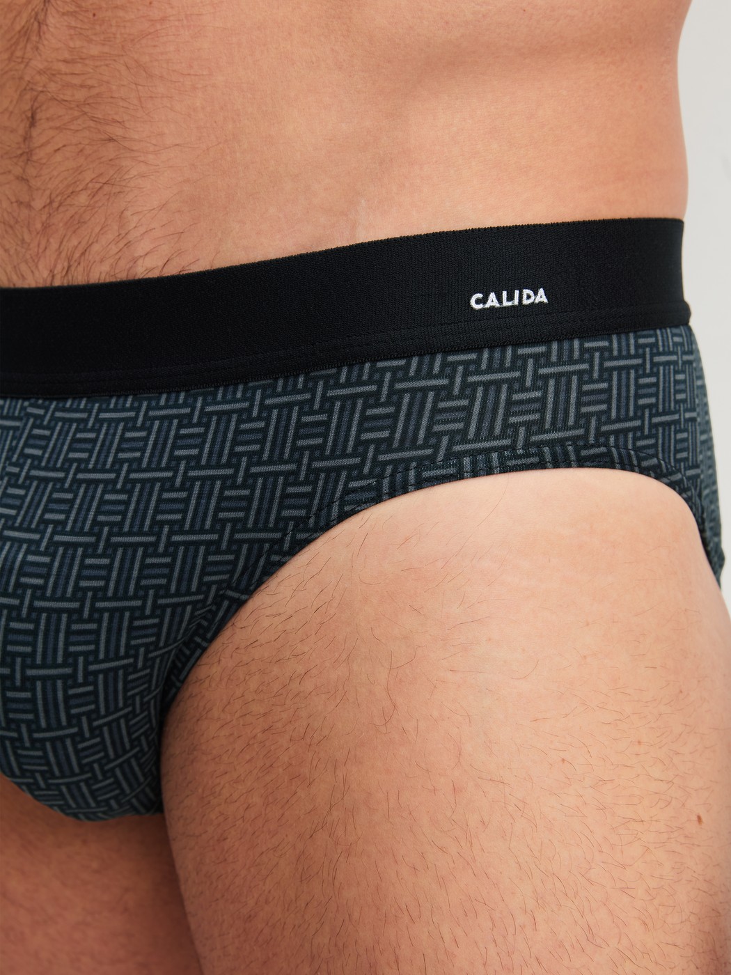 Men model is wearing Brief made of Cotton in Black, Patterned from the Cotton Code Design series by CALIDA, Detail