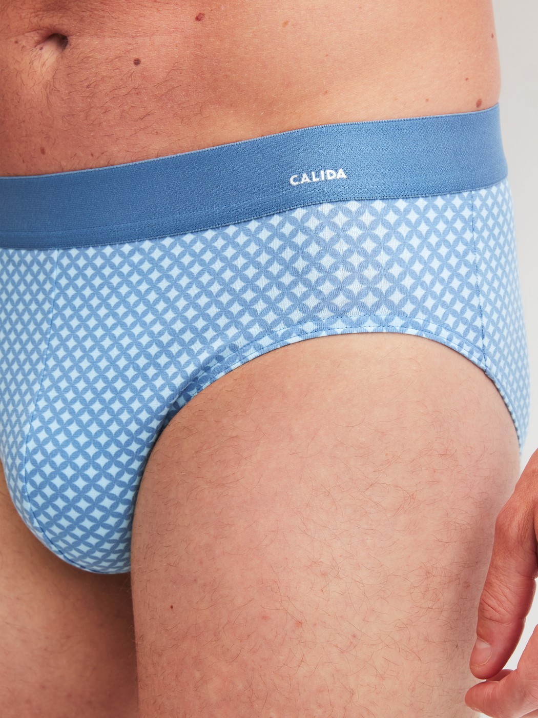 Men model is wearing Brief made of Cotton in Blue, Patterned from the Cotton Code Design series by CALIDA, Detail
