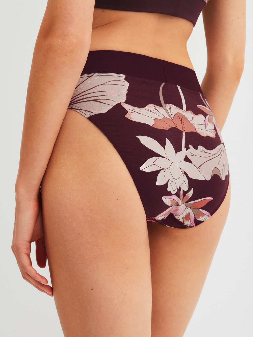 Women model is wearing Brief, high waist made of Cotton in Red, Floral from the Elastic Trend Spec. series by CALIDA, Back view