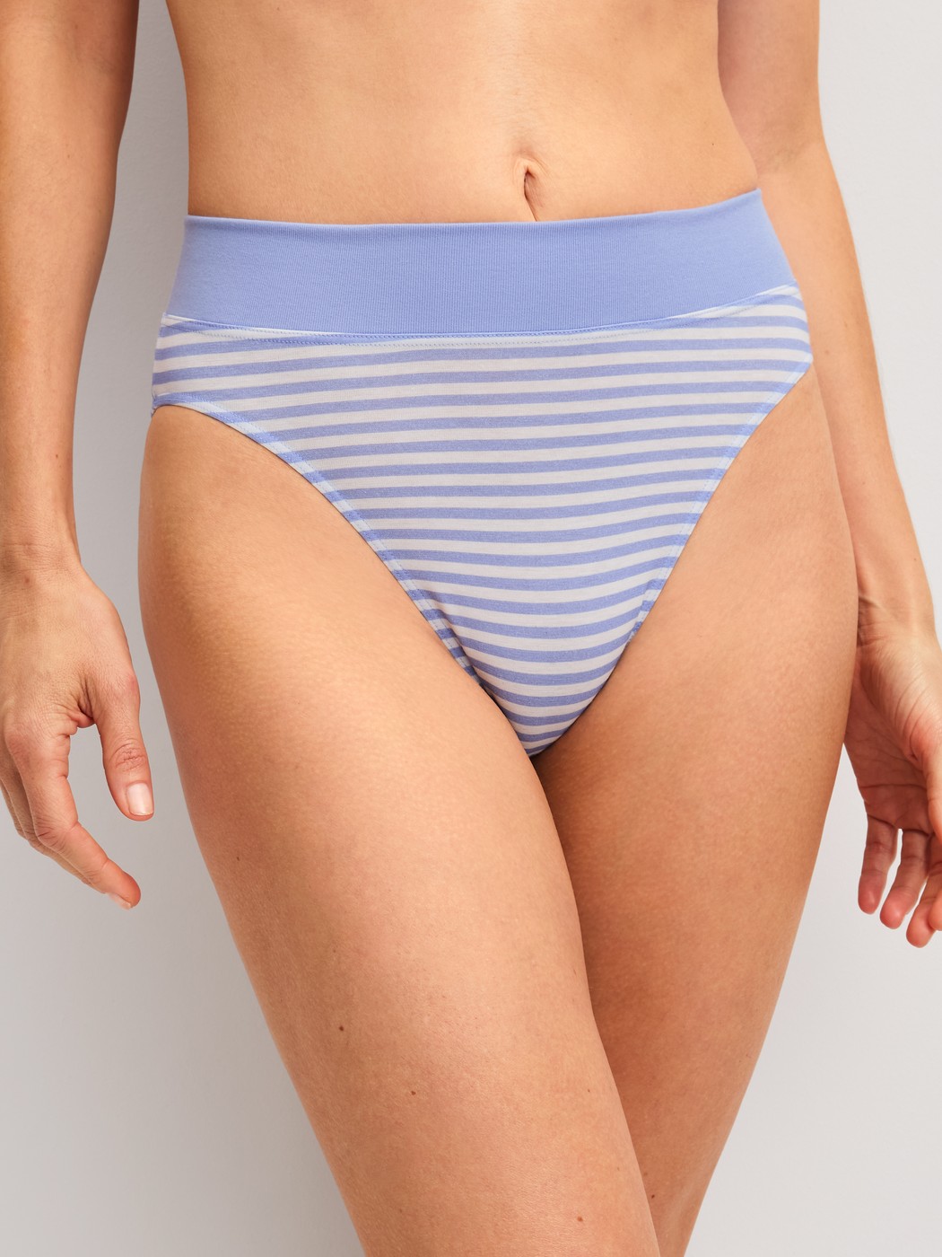 Women model is wearing Brief, high waist made of Cotton in Blue, Striped from the EDITION 85 series by CALIDA, Front view
