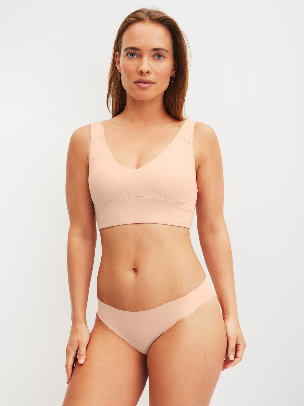 Women model is wearing Seamless Brazilian Brief made of Modal in Pink, Unicoloured from the Natural Skin series by CALIDA, Outfit