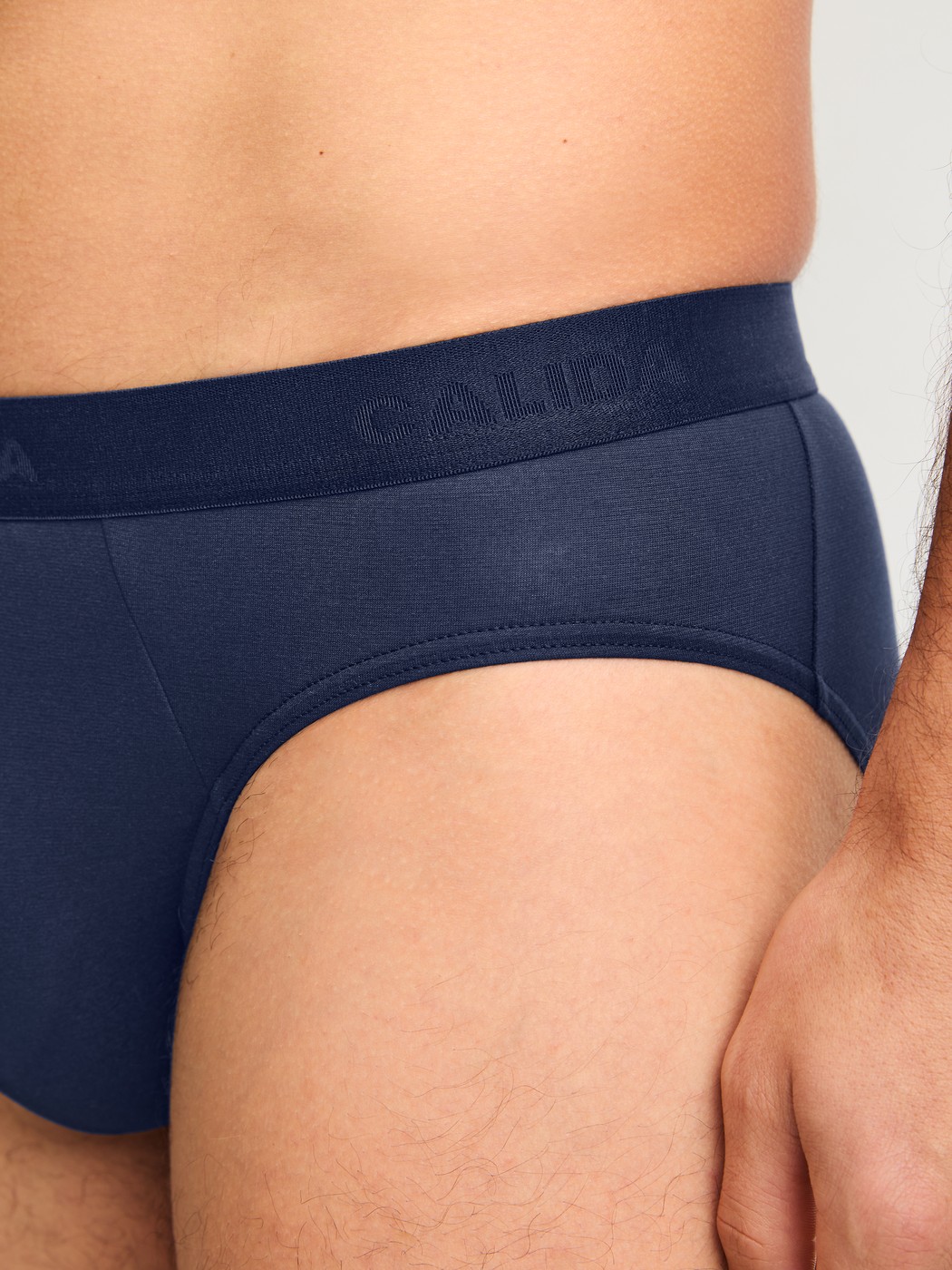 Men model is wearing Brief made of Lyocell in Blue, Unicoloured from the Natural Cooling series by CALIDA, Detail