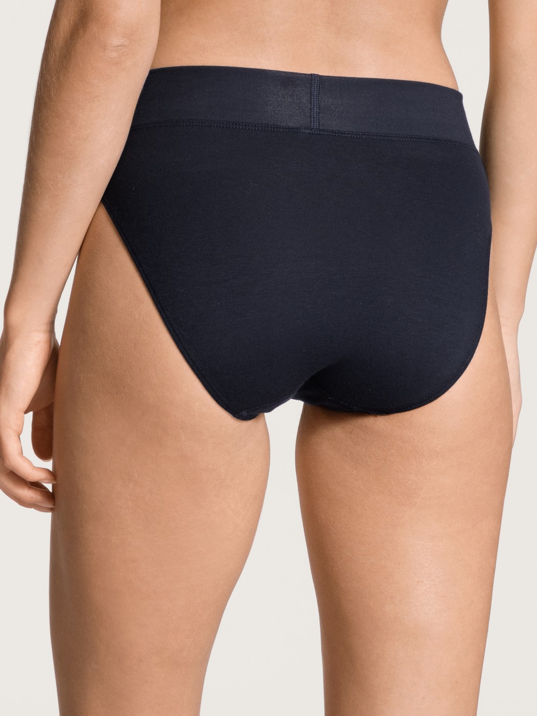 Women model is wearing High Waist Briefs, 2-Pack made of Cotton in Blue, Patterned from the Elastic Duopack series by CALIDA, Back view
