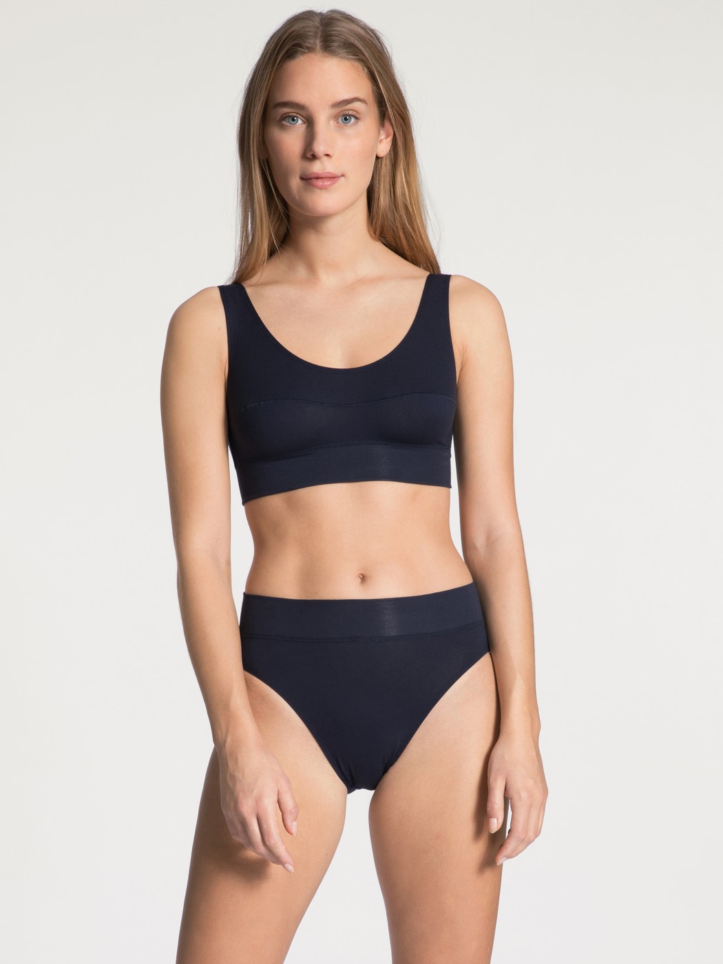 Women model is wearing High Waist Briefs, 2-Pack made of Cotton in Blue, Patterned from the Elastic Duopack series by CALIDA, Outfit
