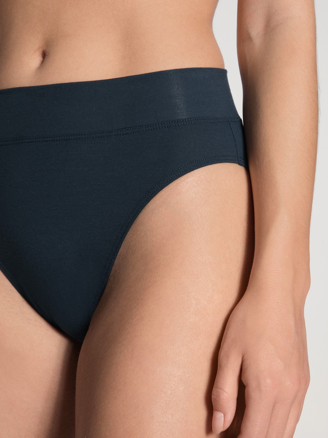 Women model is wearing High Waist Briefs, 2-Pack made of Cotton in Blue, Patterned from the Elastic Duopack series by CALIDA, Detail