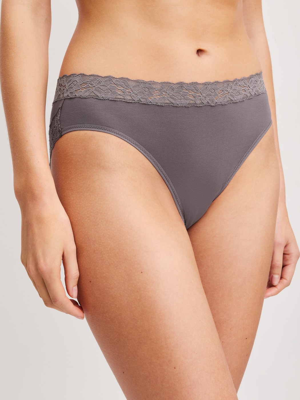 Women model is wearing Brief, regular cut made of Cotton in Brown, Lace from the Natural Comfort Lace series by CALIDA, Front view