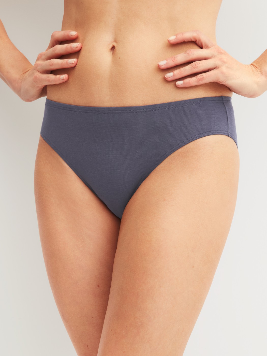 Women model is wearing Brief, regular cut made of Cotton in Grey, Unicoloured from the Essential Cotton series by CALIDA, Front view