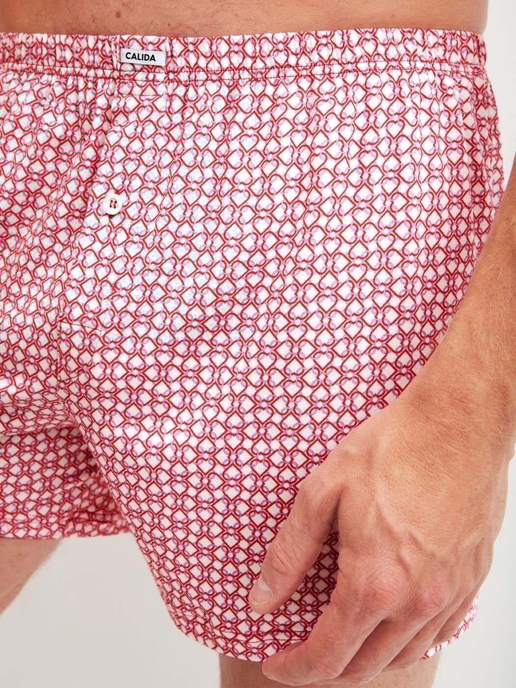 Men model is wearing Boxer shorts made of Cotton in Red, Patterned from the Valentine series by CALIDA, Detail