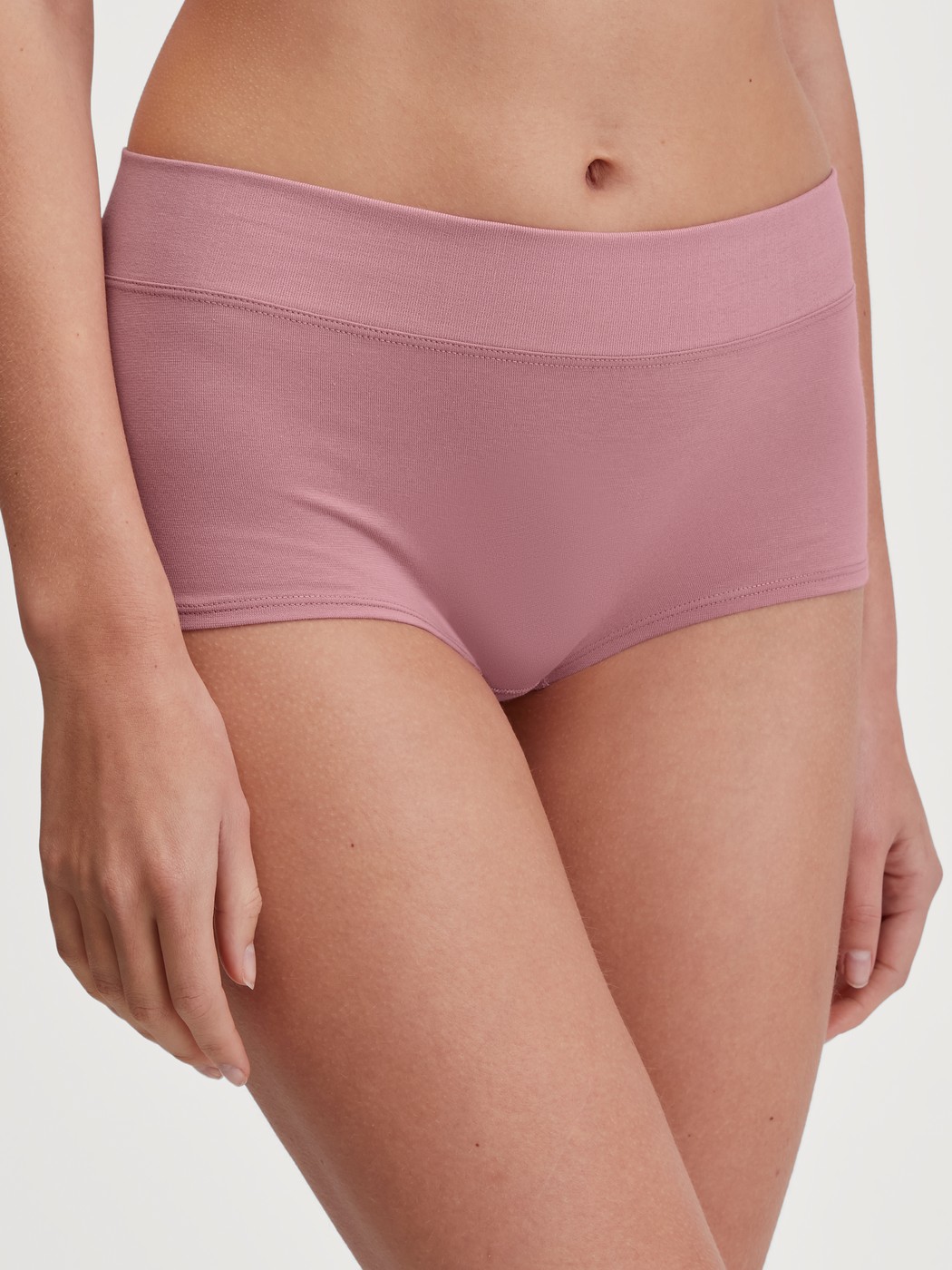 Women model is wearing Shorty regular cut made of Cotton in Pink, Unicoloured from the Elastic series by CALIDA, Front view