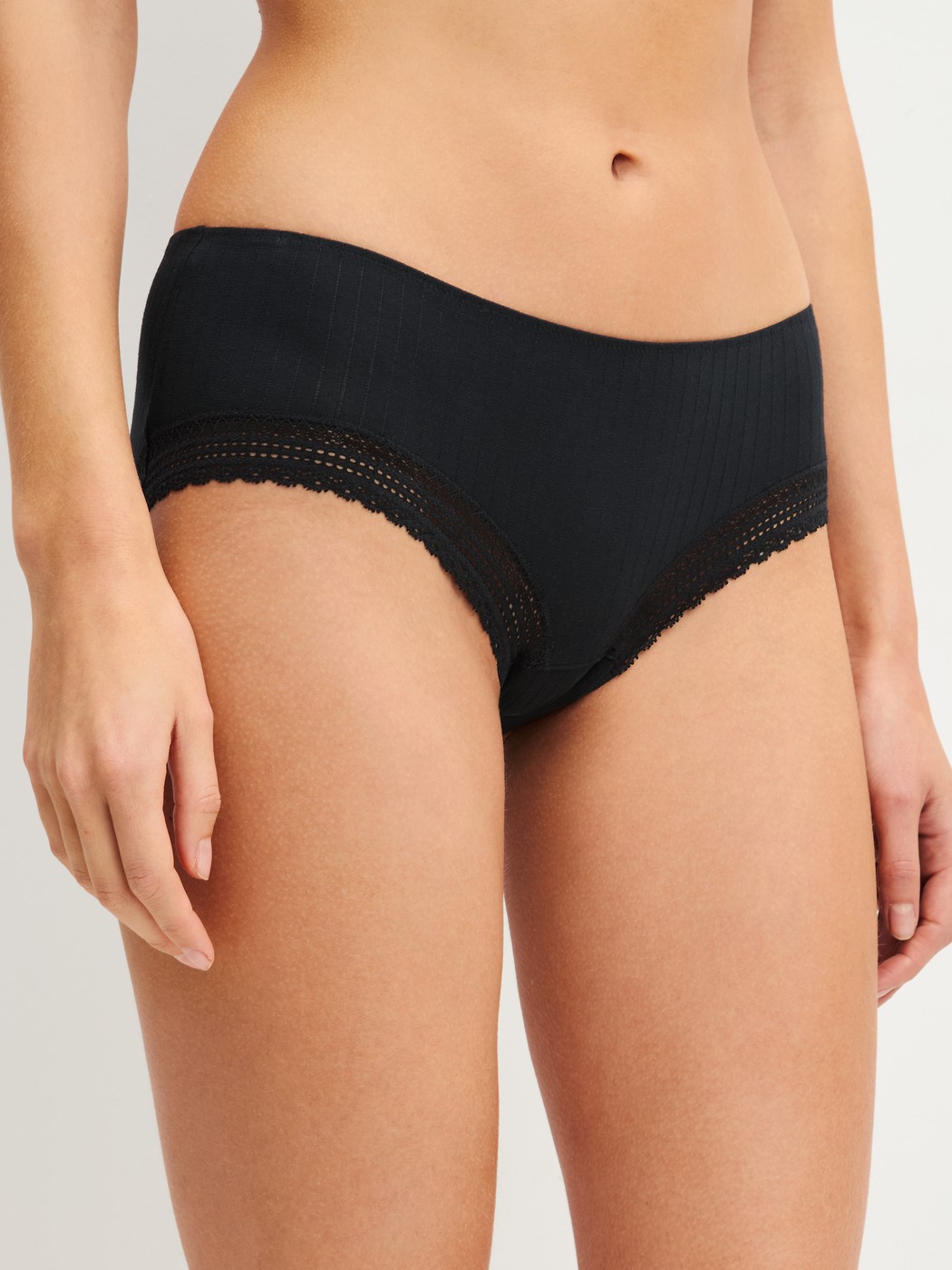 Women model is wearing Shorty made of Modal in Black, Unicoloured from the Etude Ajours series by CALIDA, Front view
