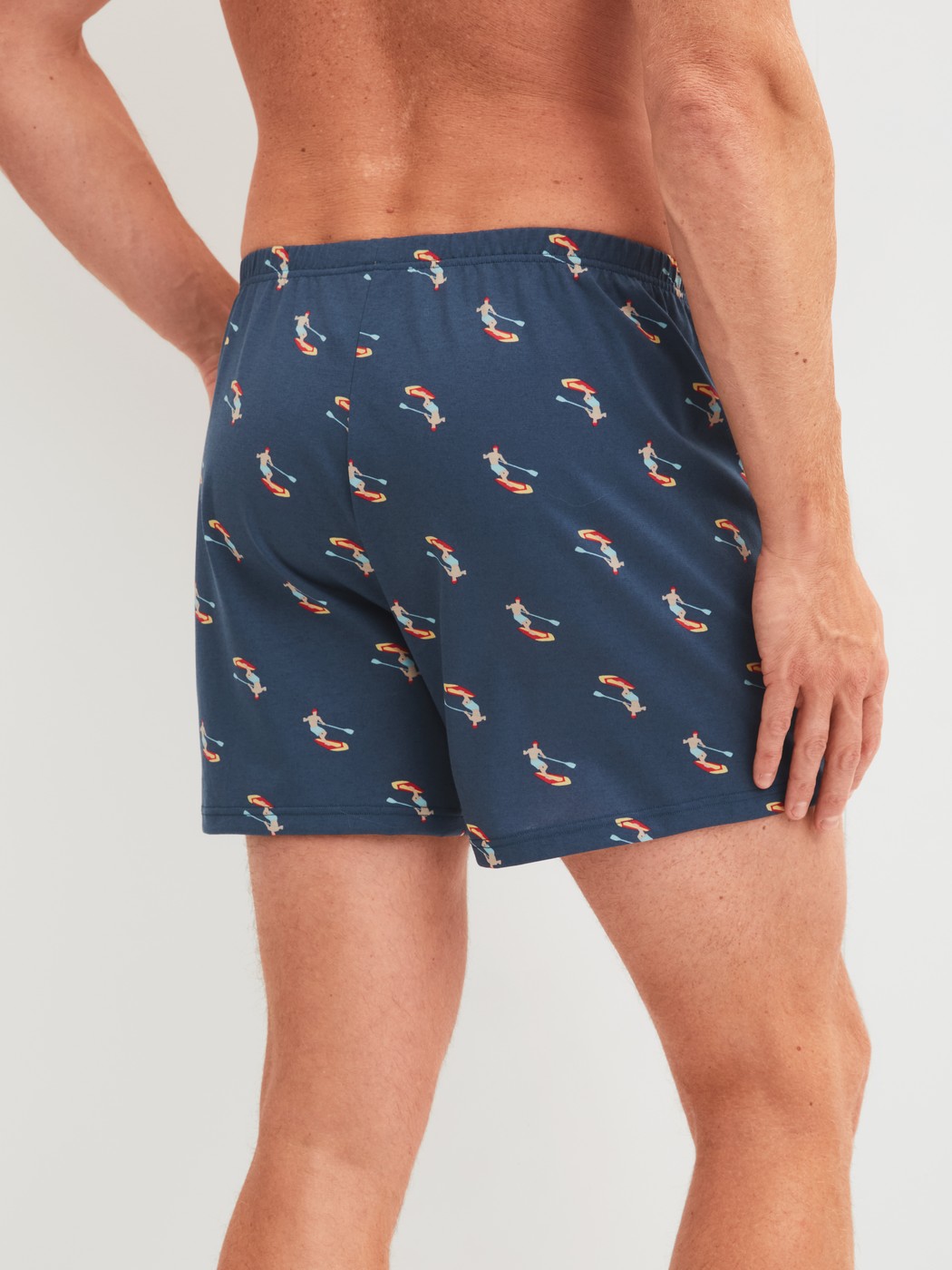 Men model is wearing Boxer shorts made of Cotton in Blue, Patterned from the Prints series by CALIDA, Back view