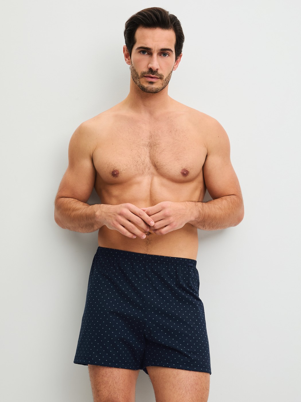 Men model is wearing Boxer shorts made of 100% Cotton in Blue, Patterned from the Prints series by CALIDA, Outfit