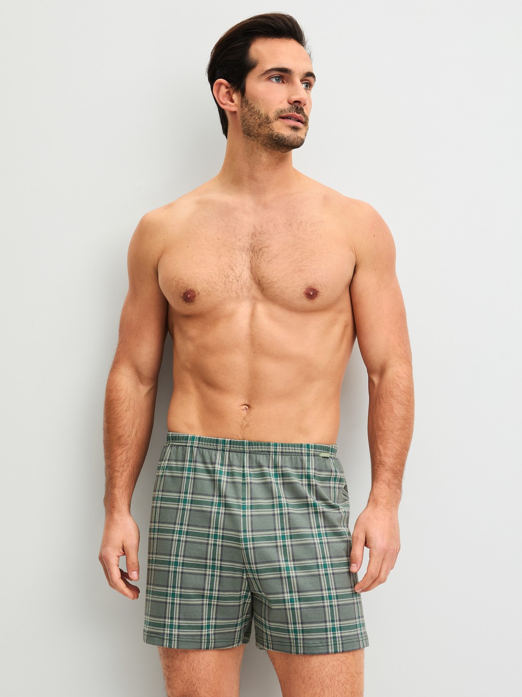 Men model is wearing Boxer shorts made of 100% Cotton in Green, Checked from the Prints series by CALIDA, Outfit