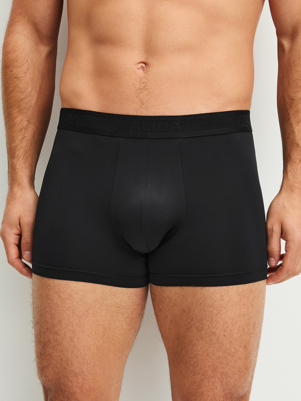 Men model is wearing Boxer brief made of Polyamide in Black, Unicoloured from the Micro Stretch series by CALIDA, Front view