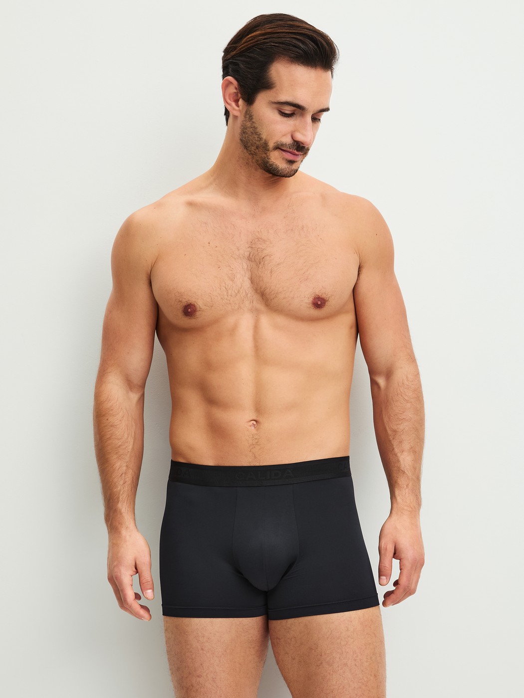 Men model is wearing Boxer brief made of Polyamide in Black, Unicoloured from the Micro Stretch series by CALIDA, Outfit