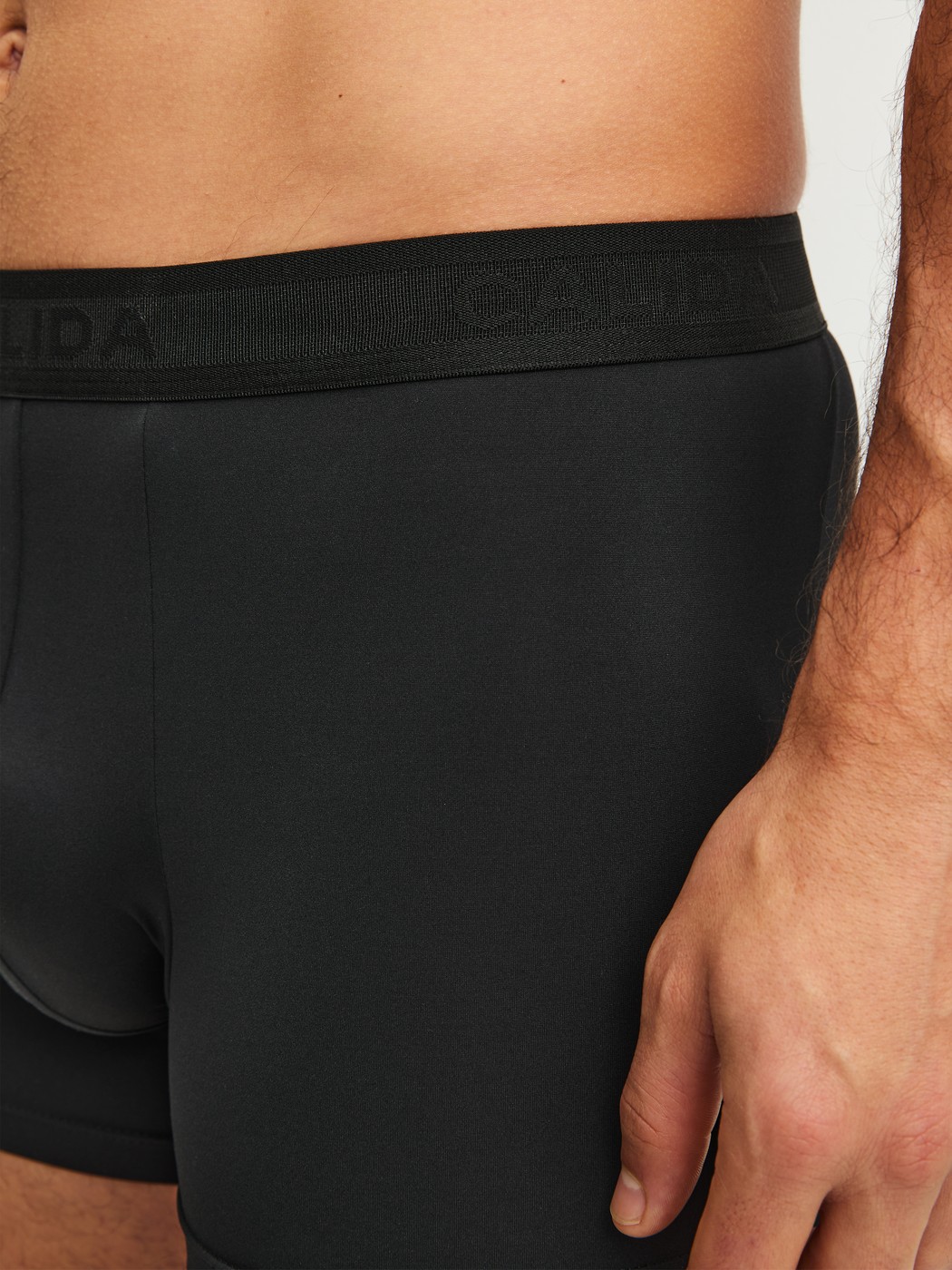 Men model is wearing Boxer brief made of Polyamide in Black, Unicoloured from the Micro Stretch series by CALIDA, Detail