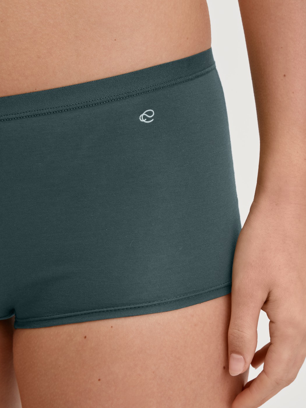 Women model is wearing Shorty regular cut made of Cotton in Green, Unicoloured from the Natural Comfort series by CALIDA, Detail