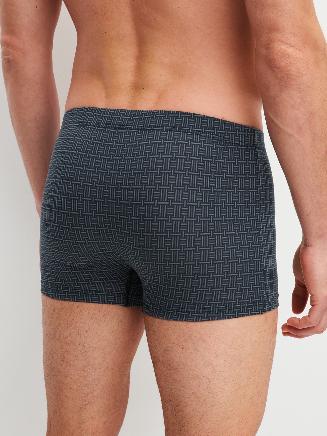 Men model is wearing Boxer brief made of Cotton in Black, Patterned from the Cotton Code Design series by CALIDA, Back view