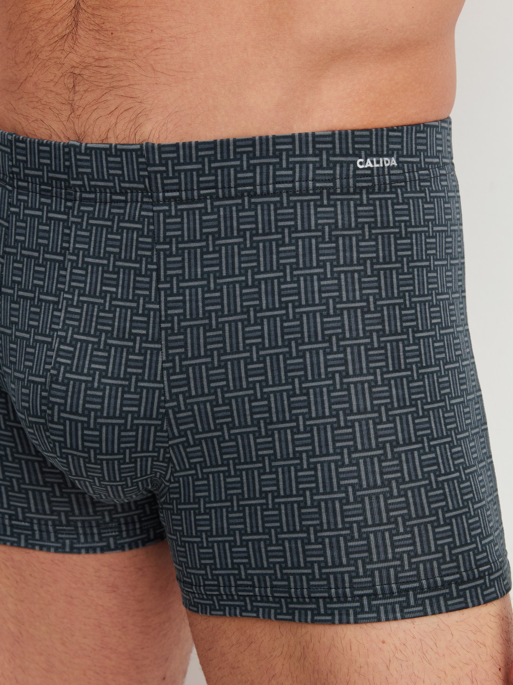 Men model is wearing Boxer brief made of Cotton in Black, Patterned from the Cotton Code Design series by CALIDA, Detail
