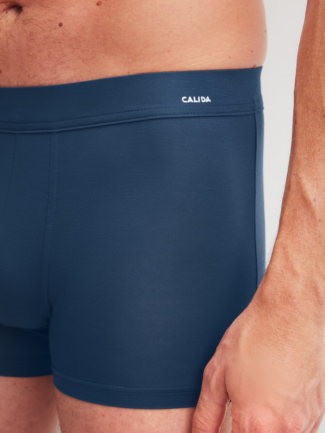 Men model is wearing Boxer brief with Quick Dry Effect made of Modal in Blue, Unicoloured from the Balanced Day series by CALIDA, Detail