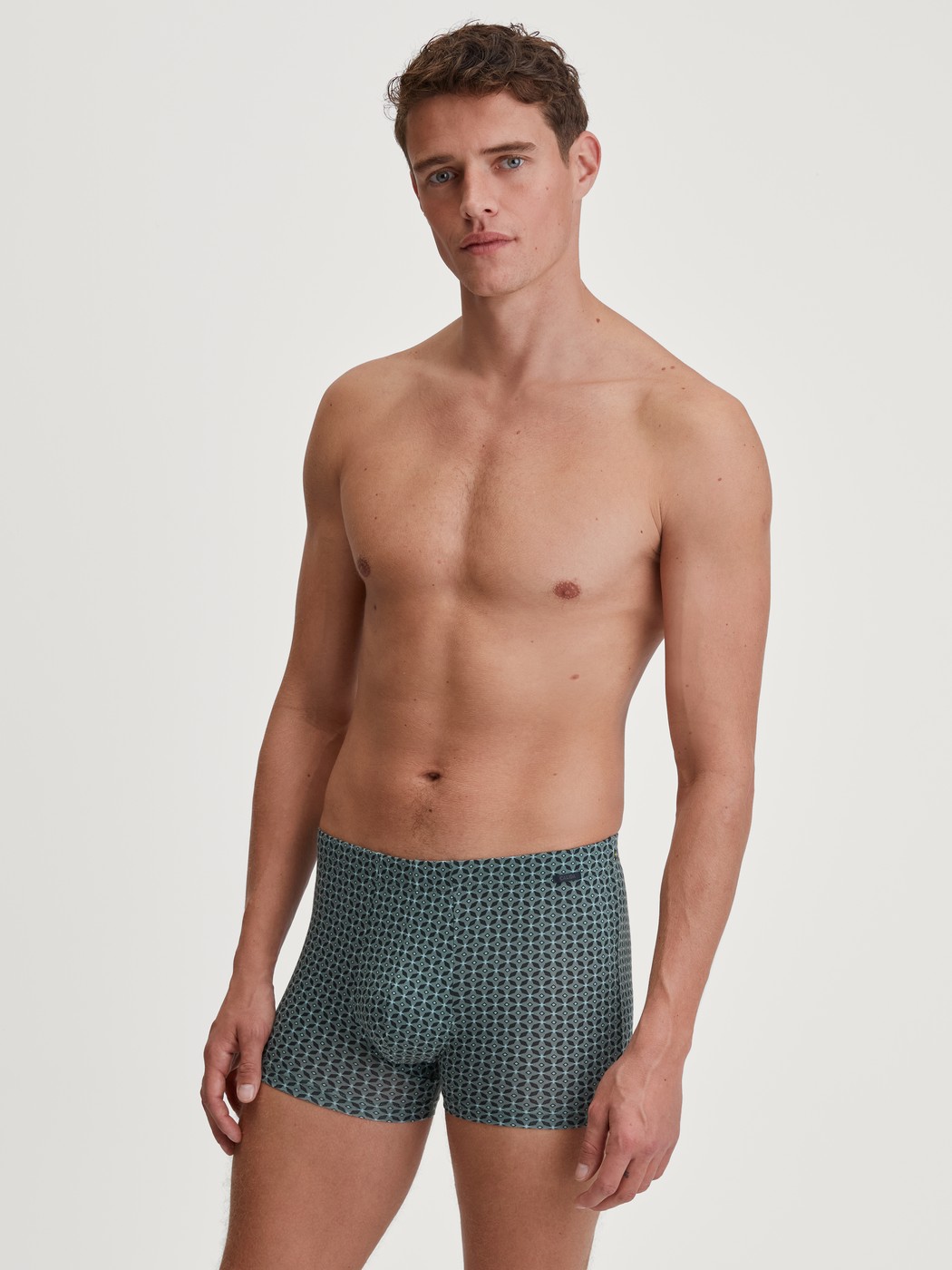 Men model is wearing Boxer brief made of TENCEL™ in Green, Patterned from the Focus Trend series by CALIDA, Outfit