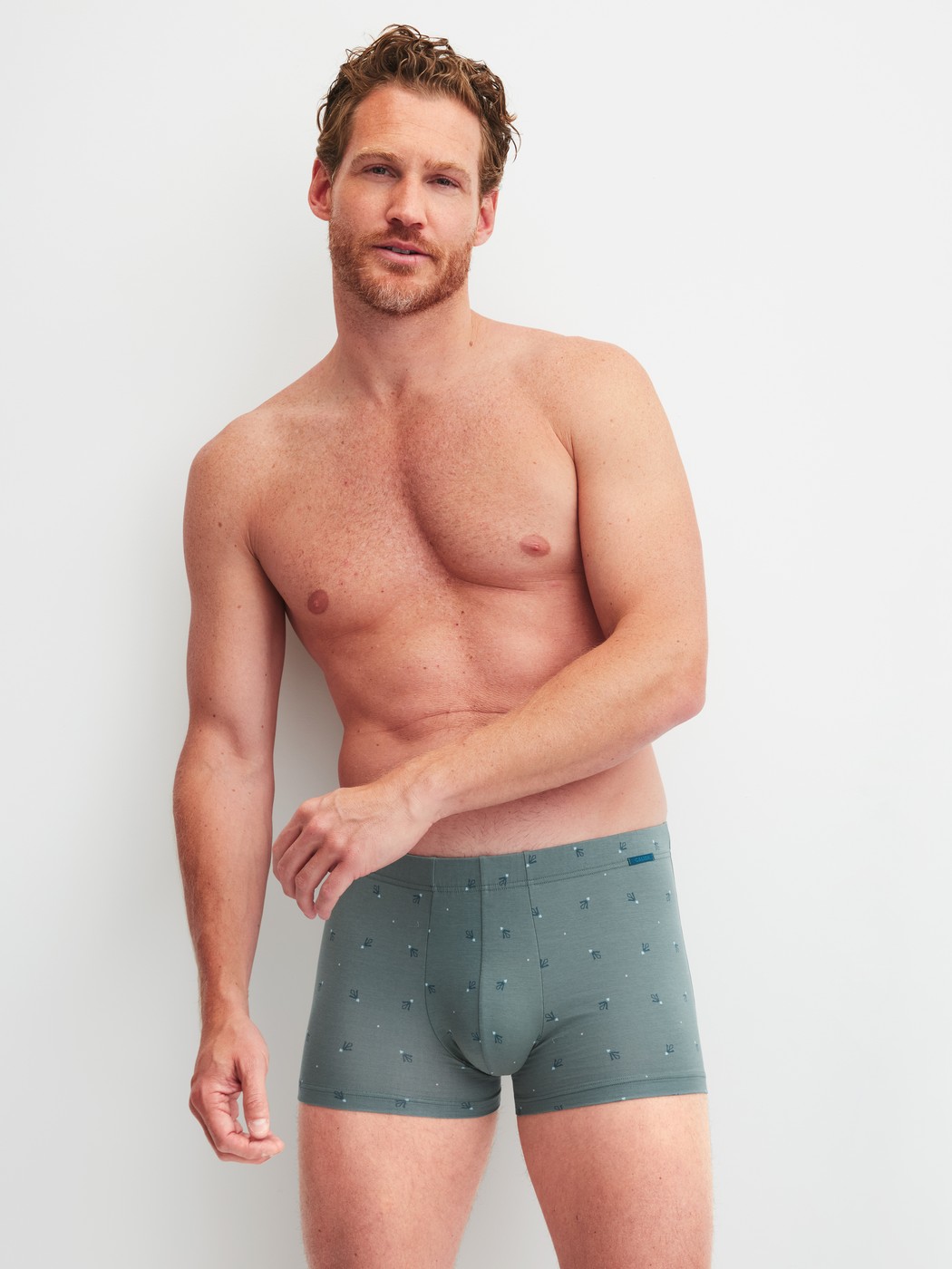 Men model is wearing Boxer brief made of Cotton in Green, Patterned from the Grafic Cotton series by CALIDA, Outfit