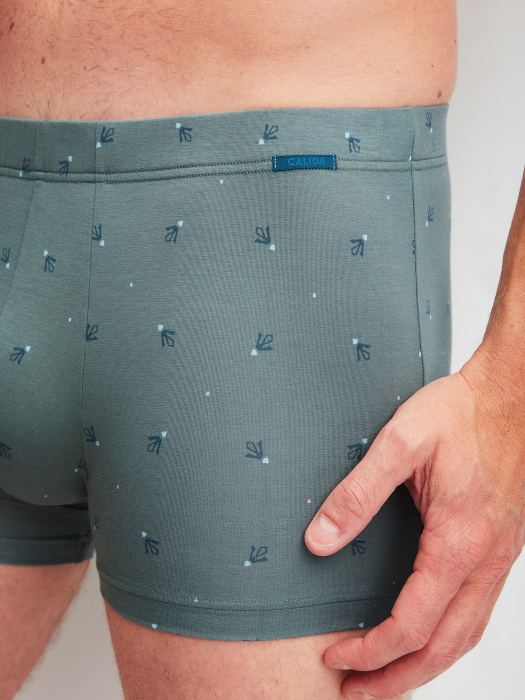 Men model is wearing Boxer brief made of Cotton in Green, Patterned from the Grafic Cotton series by CALIDA, Detail