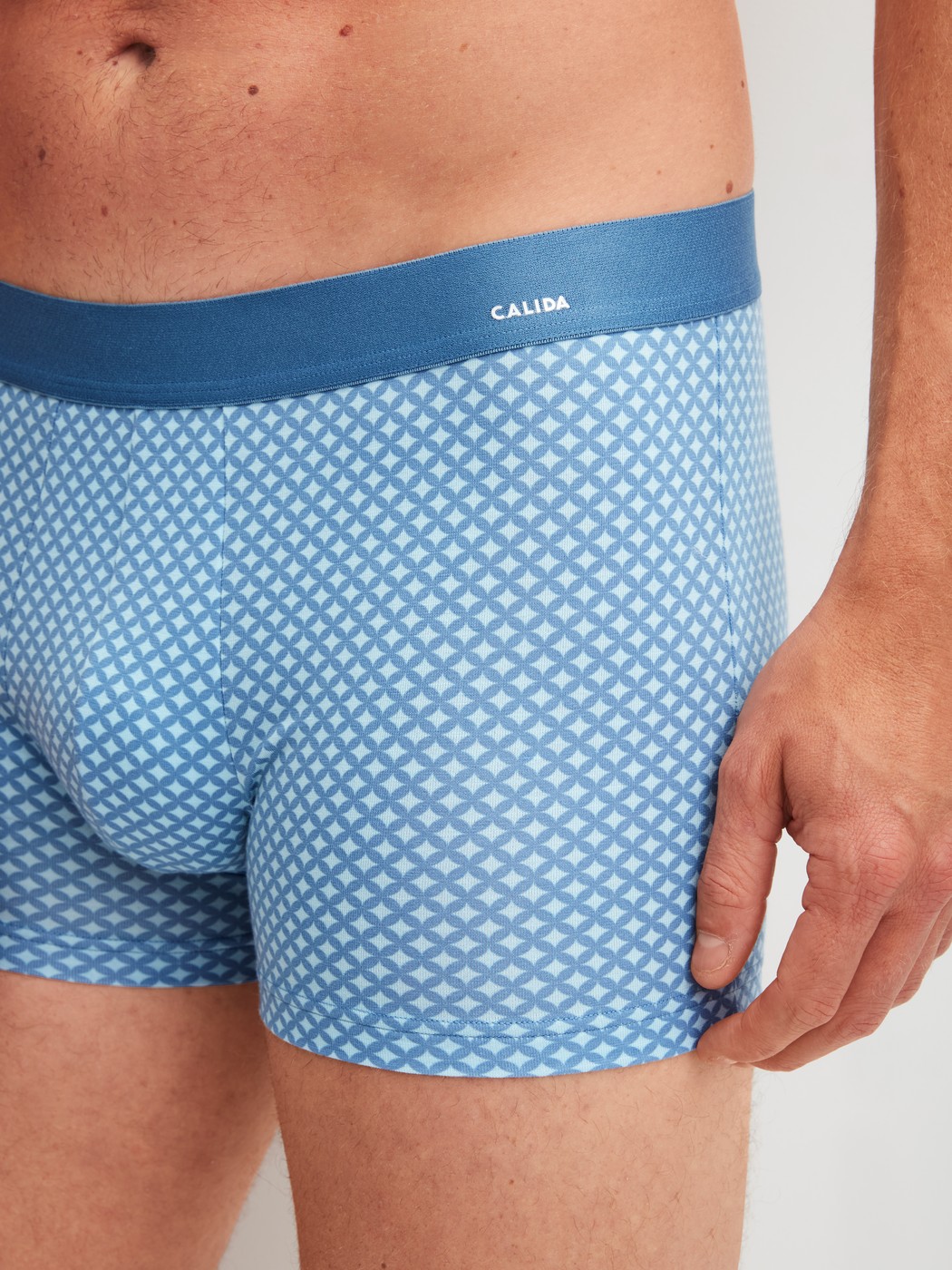 Men model is wearing Boxer brief made of Cotton in Blue, Patterned from the Cotton Code Design series by CALIDA, Detail