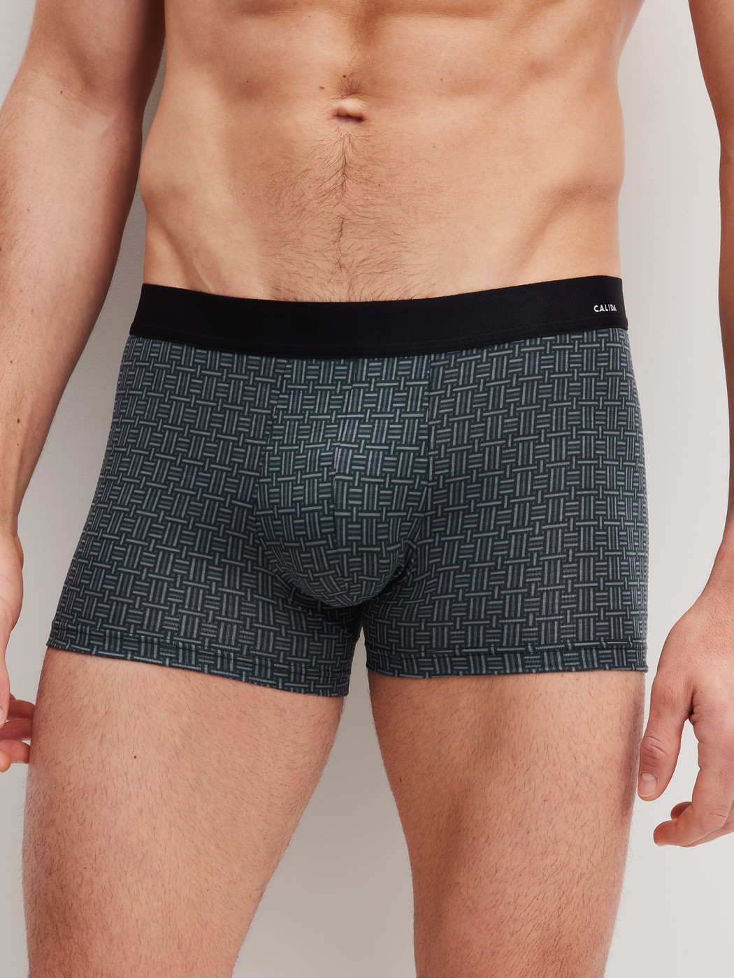 Men model is wearing Boxer brief made of Cotton in Black, Patterned from the Cotton Code Design series by CALIDA, Front view