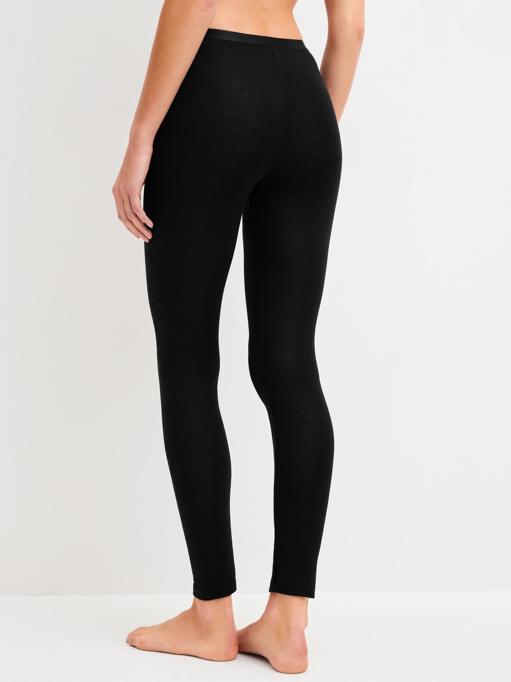 Women model is wearing  made of Wool in Black, Unicoloured from the True Confidence series by CALIDA, Back view