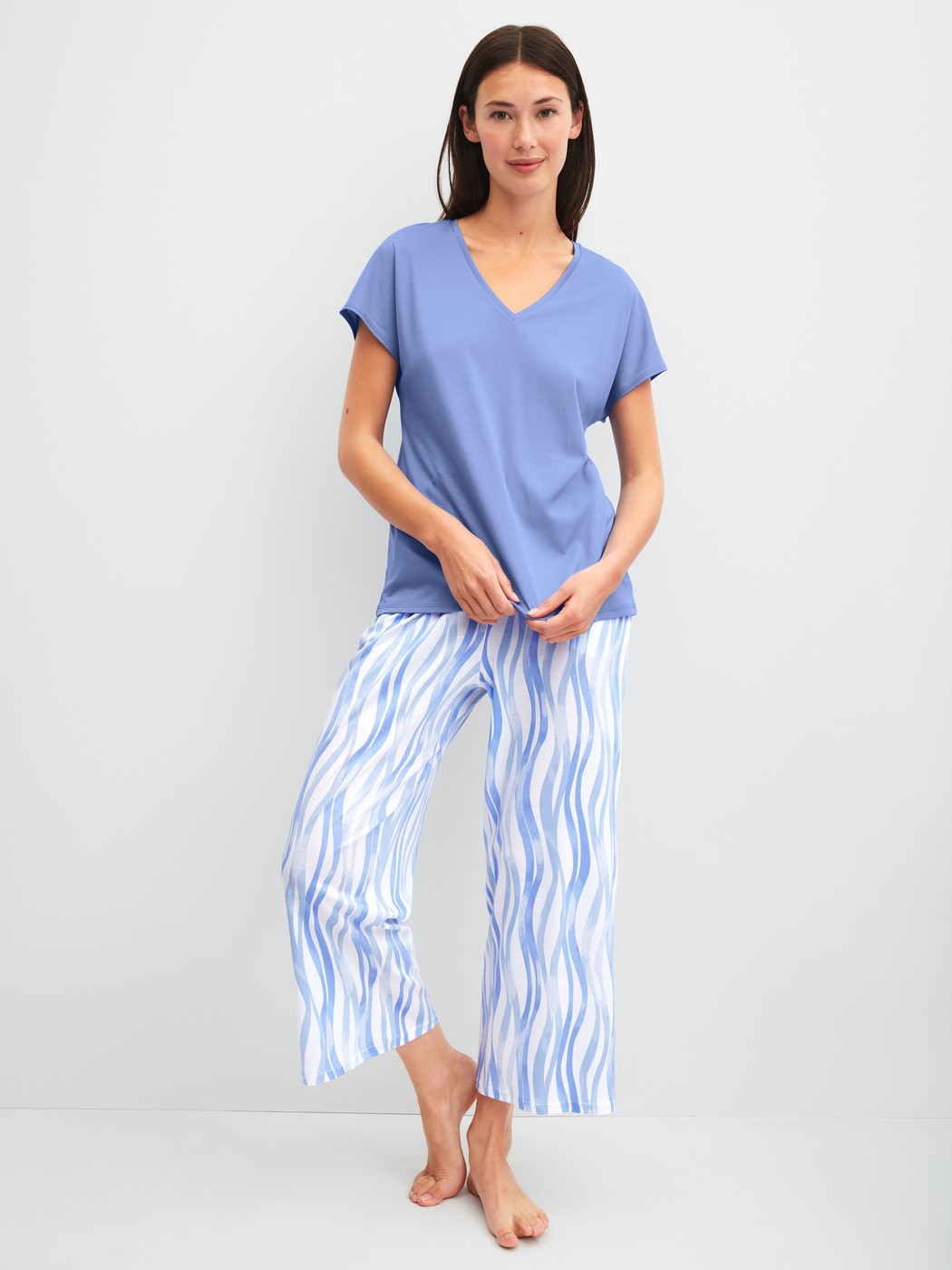 Women model is wearing 7/8 pyjama trousers made of Cotton in Blue, Patterned from the Favourites Ocean series by CALIDA, Outfit