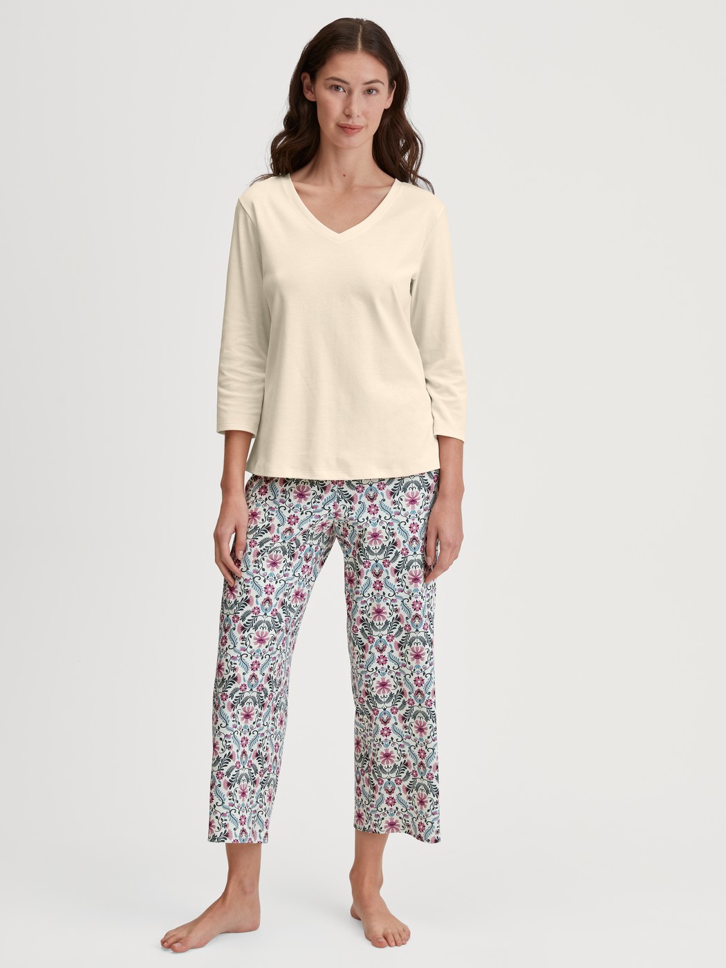 Women model is wearing 7/8 Pyjama bottom made of 100% Cotton in Pink, Patterned from the Favourites Botanic series by CALIDA, Outfit