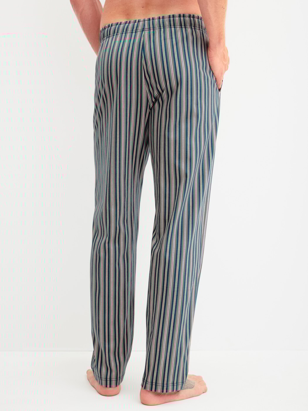 Men model is wearing Pyjama Bottoms with Side Pockets made of 100% Cotton in Green, Striped from the RMX Sleep Leisure series by CALIDA, Back view